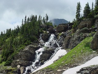 a waterfall at the Continental Divide near Logan Pass on Going To The Sun Highway